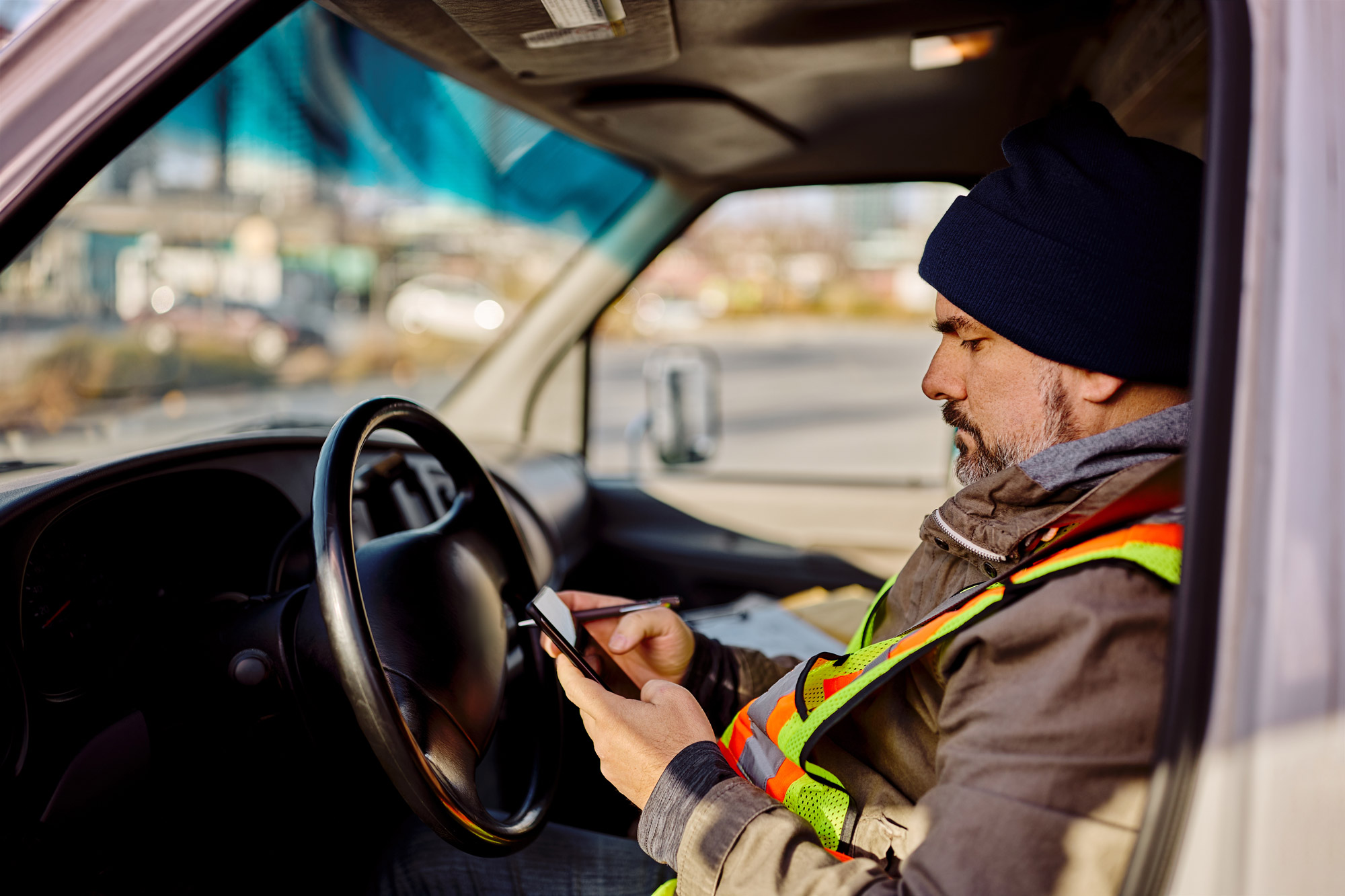 man using Pigview Mobile pig tracking software in truck